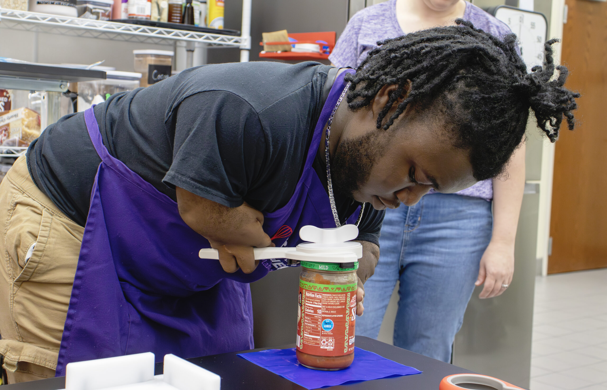 IATP Customer Using an Adpated Jar Opener with a Non-Slip Pad IATP Customer Using an Adpated Jar Opener with a Non-Slip Pad